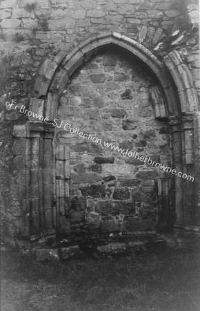 ATHASSEL PRIORY  BUILT UP DOORWAY AT S.W. ANGLE OF CLOISTERS IN S. WALL